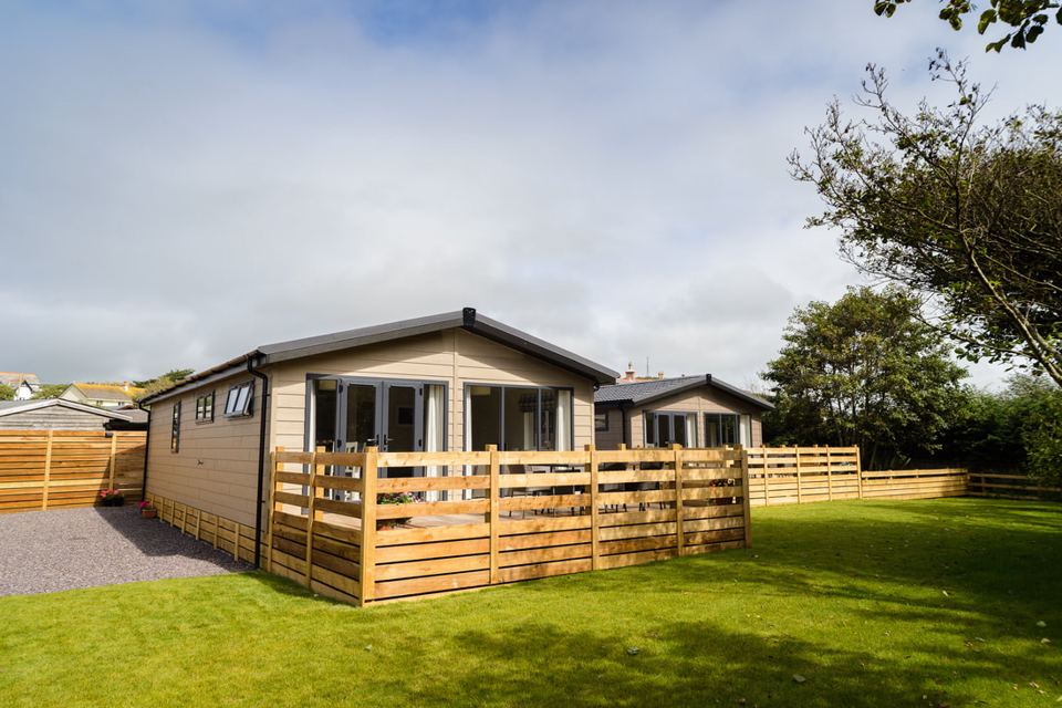 Lodges behind the wooden fence