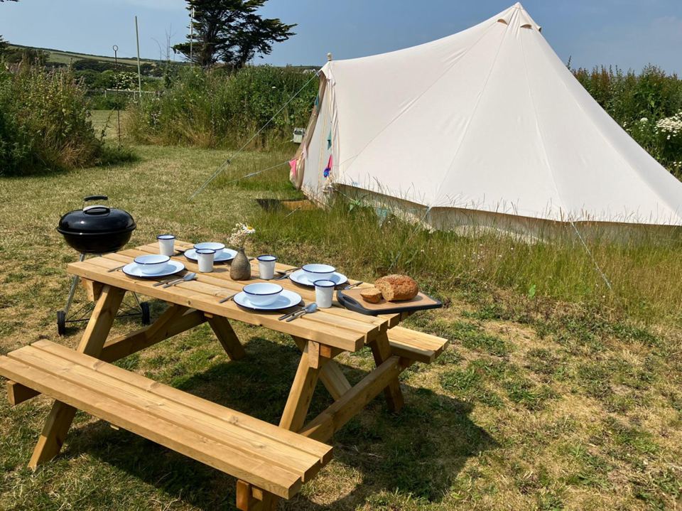 Bell tent beside the picnic table