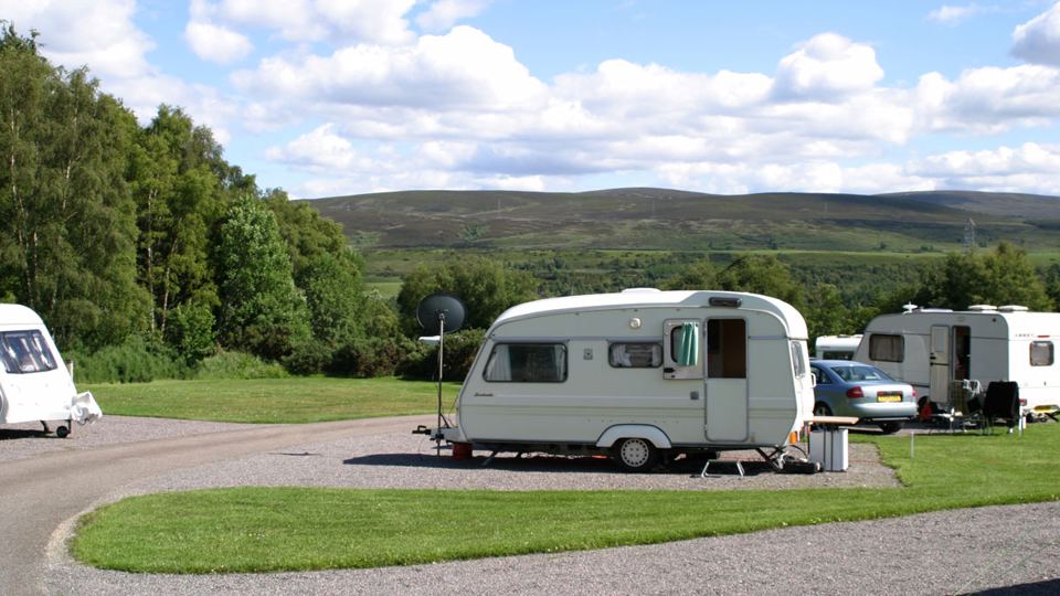 Hardstanding pitch with lawn