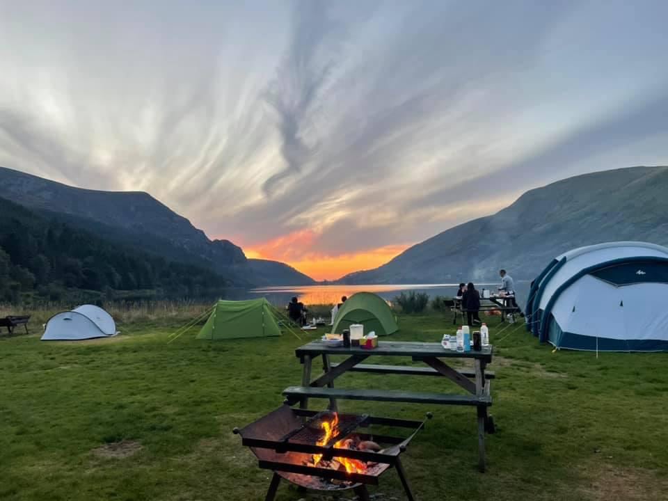 Fire pit and tents at dusk