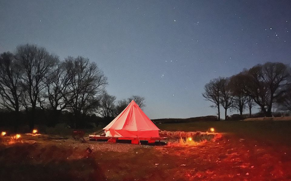 Bell tent lit at night