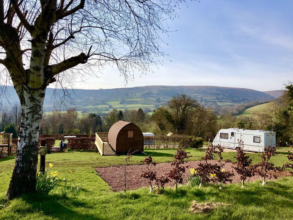 Pods and caravans with hill views