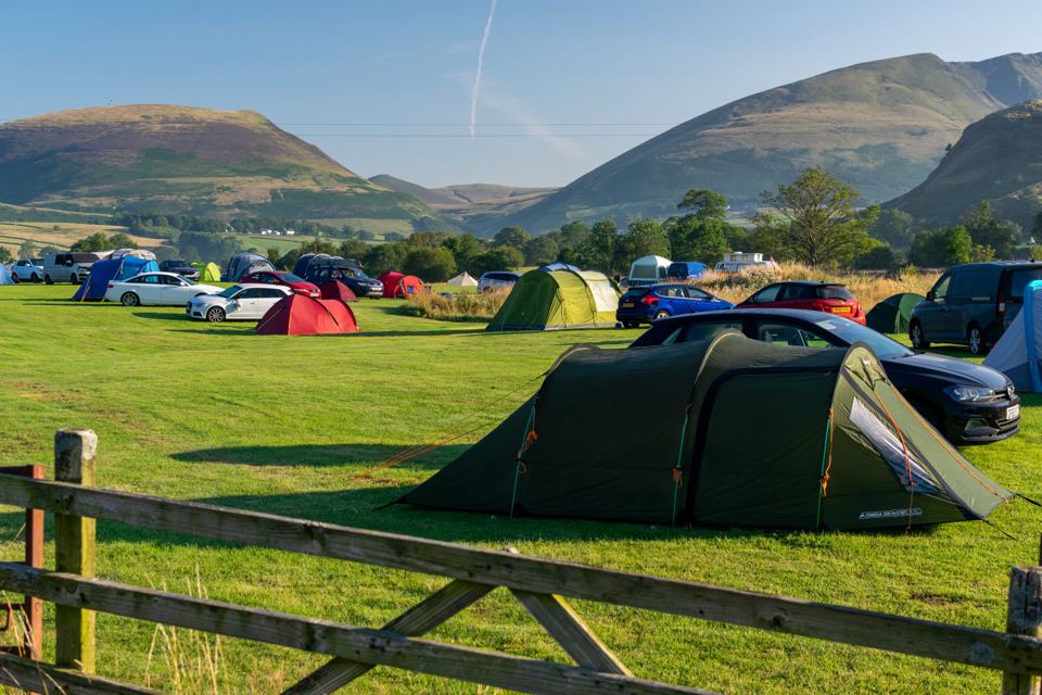 Tents on the grass by the gate
