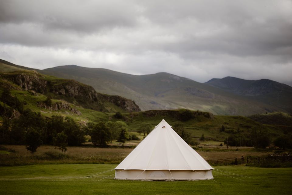 Bell tent pitched below the hills