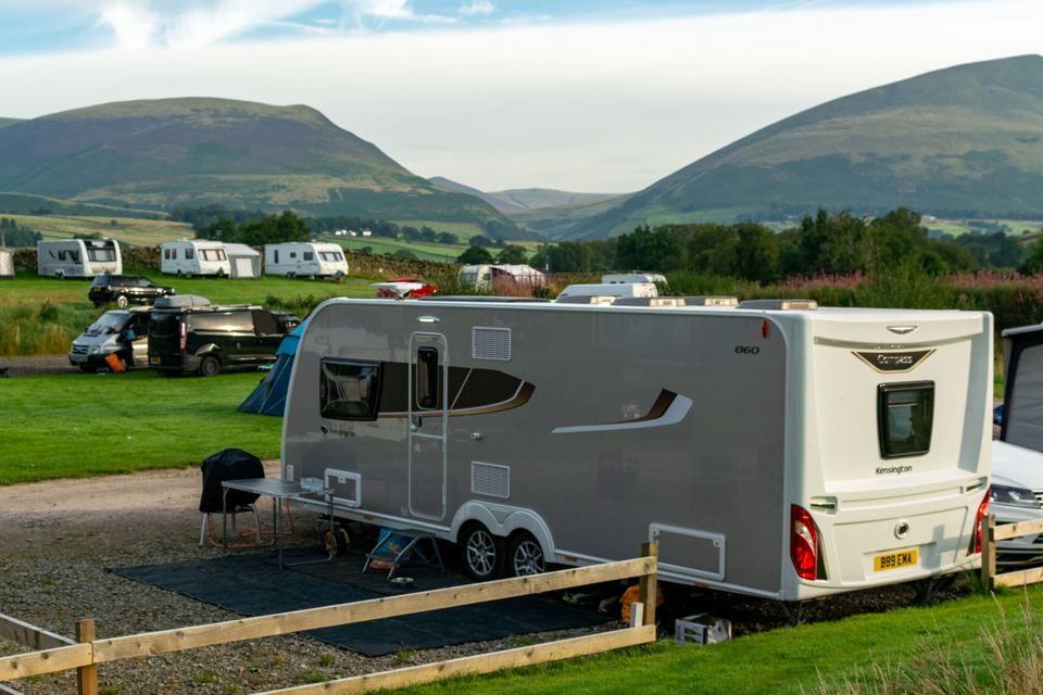 Caravan pitch with hills behind