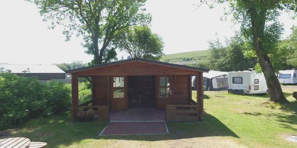 Log cabin by the touring field