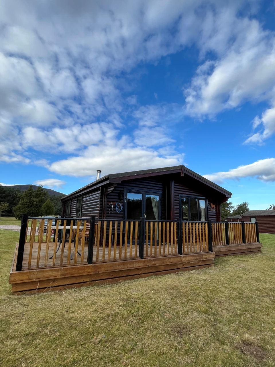 Dark-clad chalet on the grass