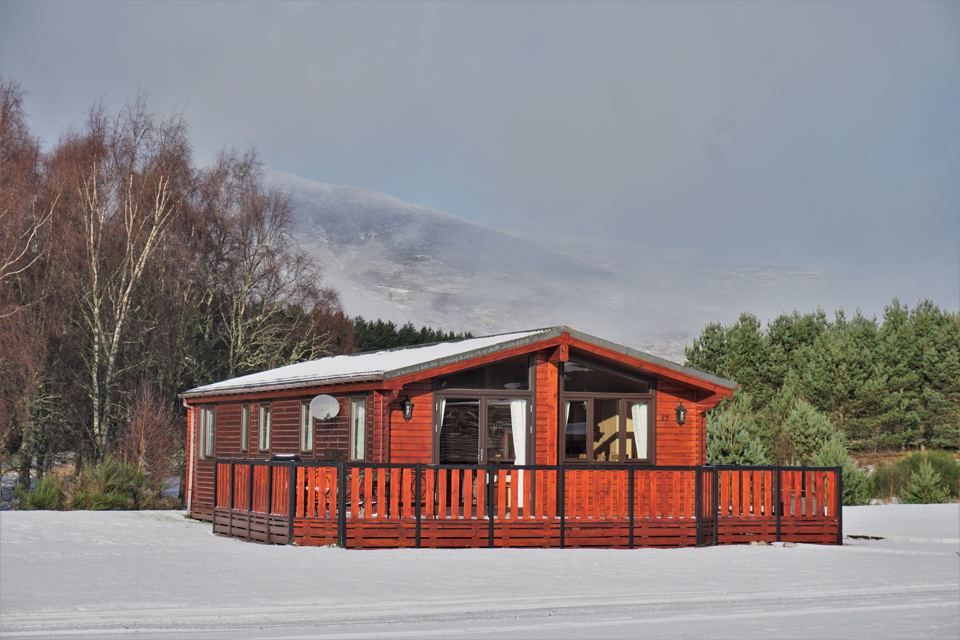 Chalet with mountain backdrop