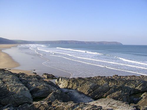 Surf on the beach below the cliffs