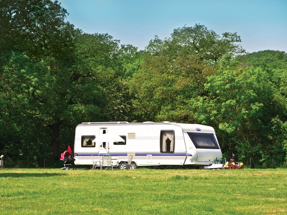 Caravan on open grass