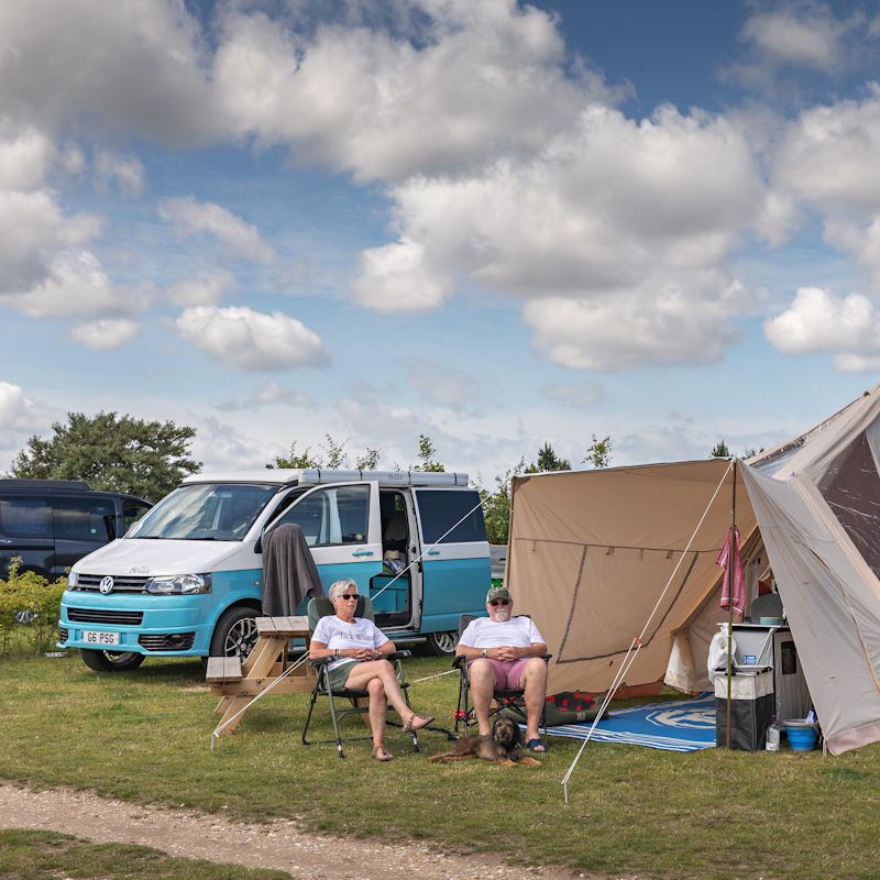Campervan and awning on a grass pitch