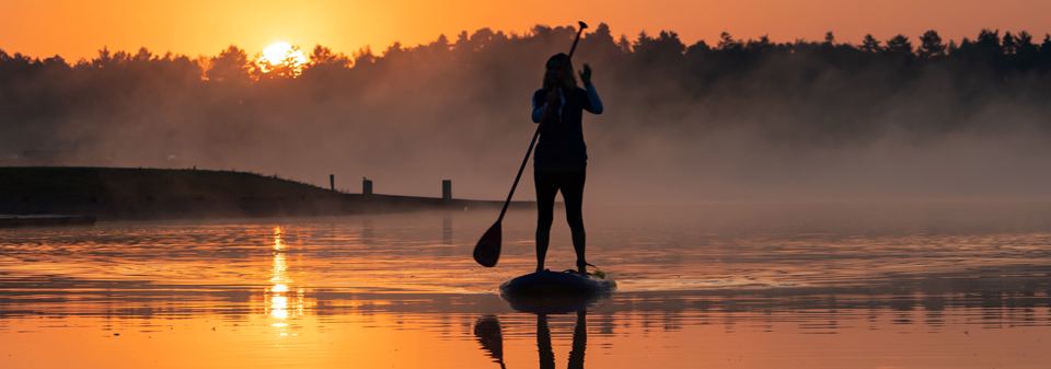 Paddleboarding at sunrise