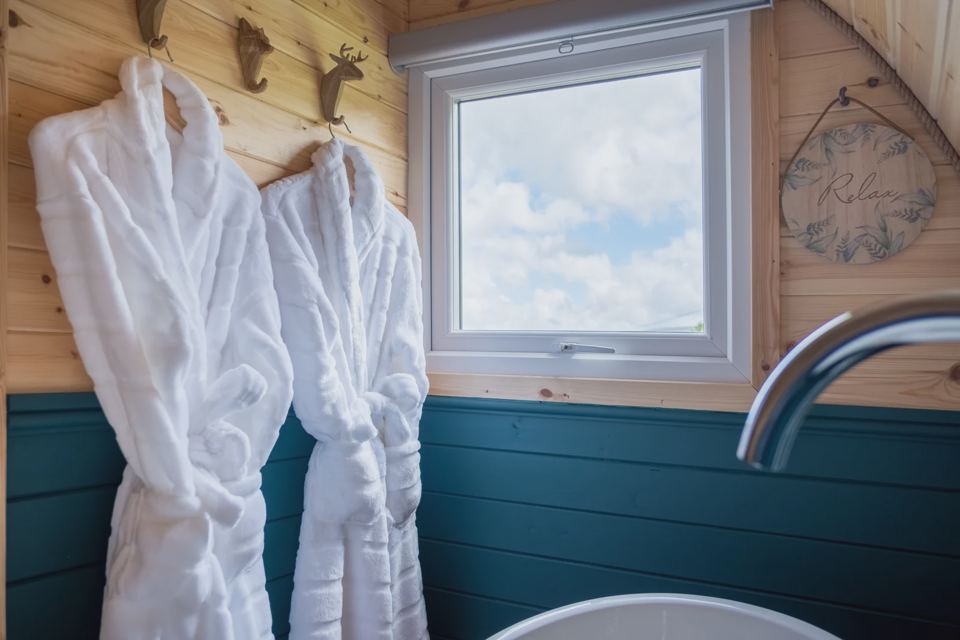Robes by the window in the pod
