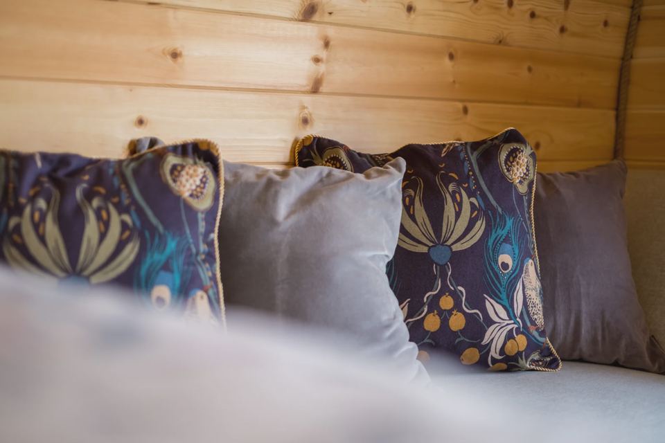 Bed with patterned cushions