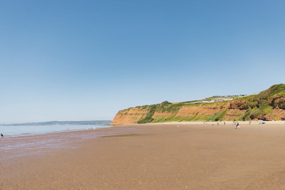 Beach below red cliffs