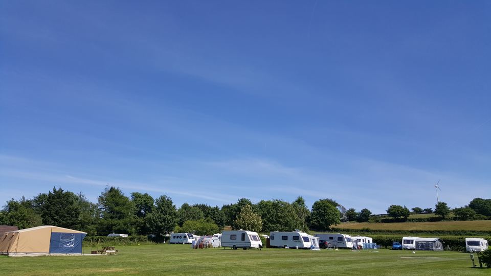 Tents and caravans in the field