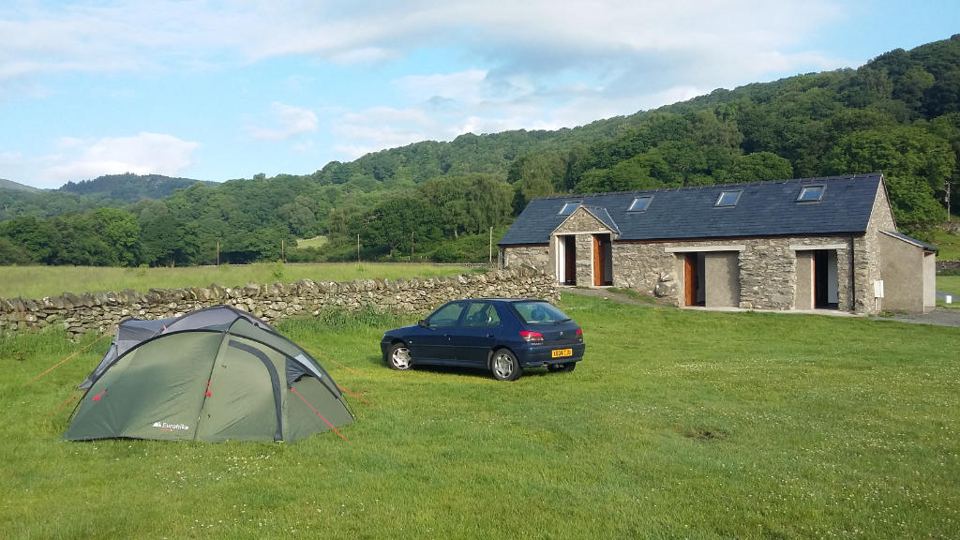 Tent by the stone shower block
