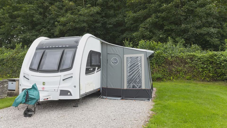 Caravan with awning on the grass
