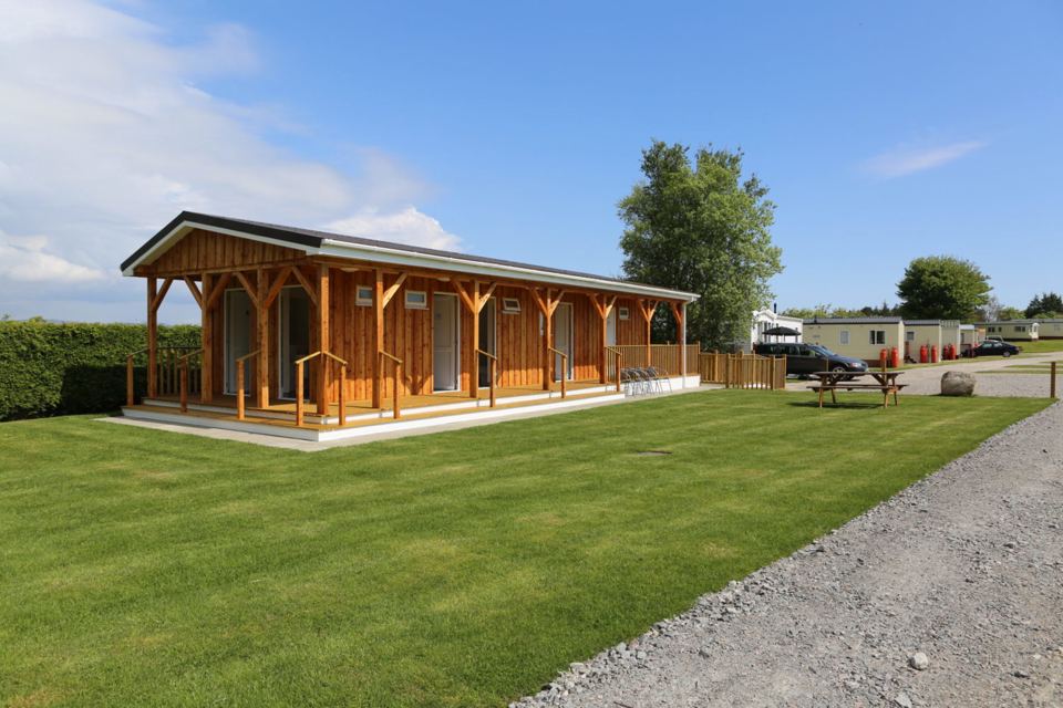 Timber lodge on the park lawn