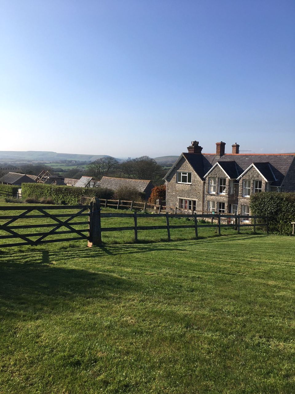 Farmhouse across the grass
