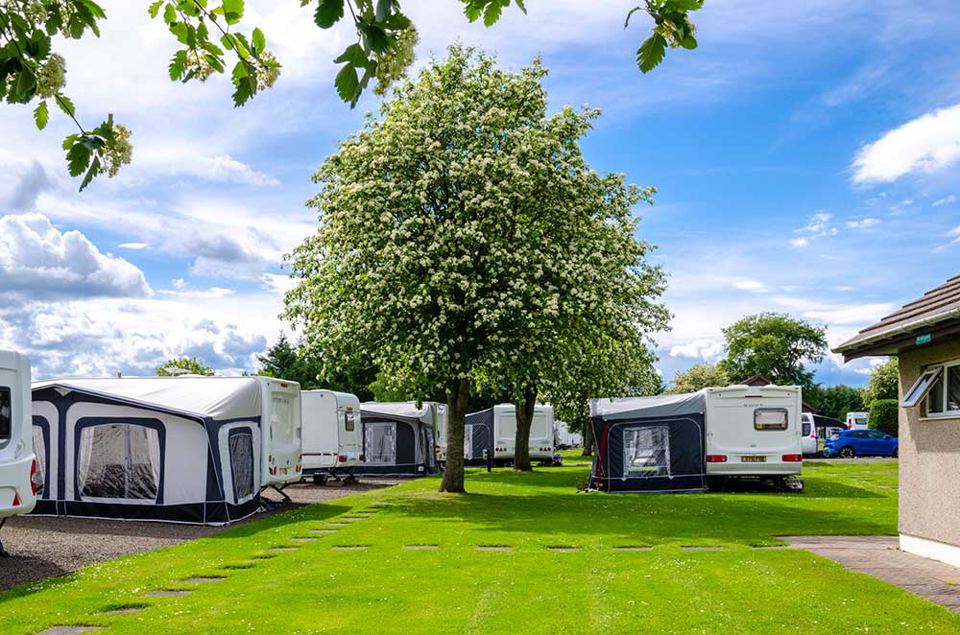 Caravans with awnings on grass