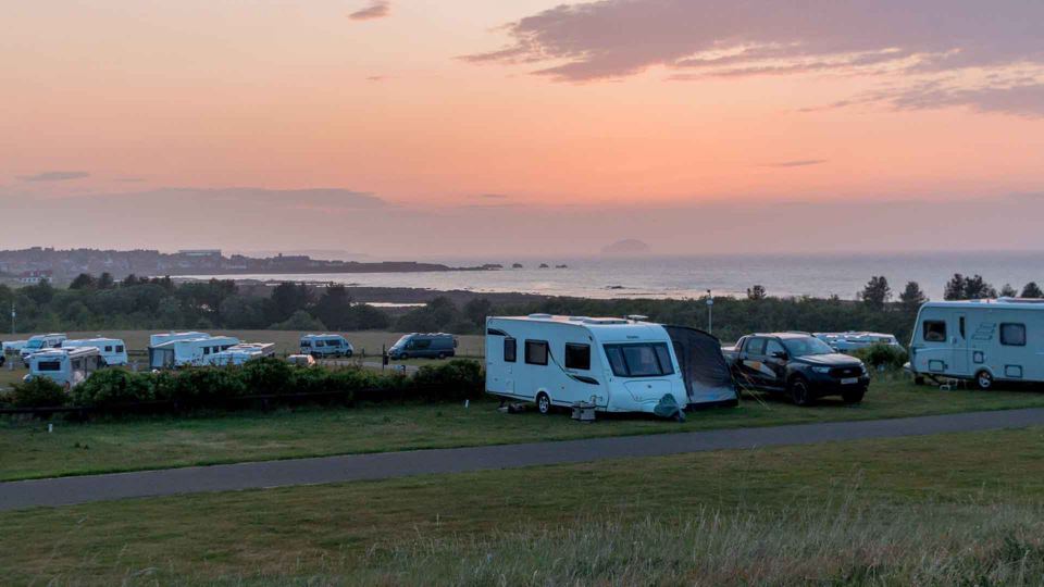 Caravans at sunset above the sea