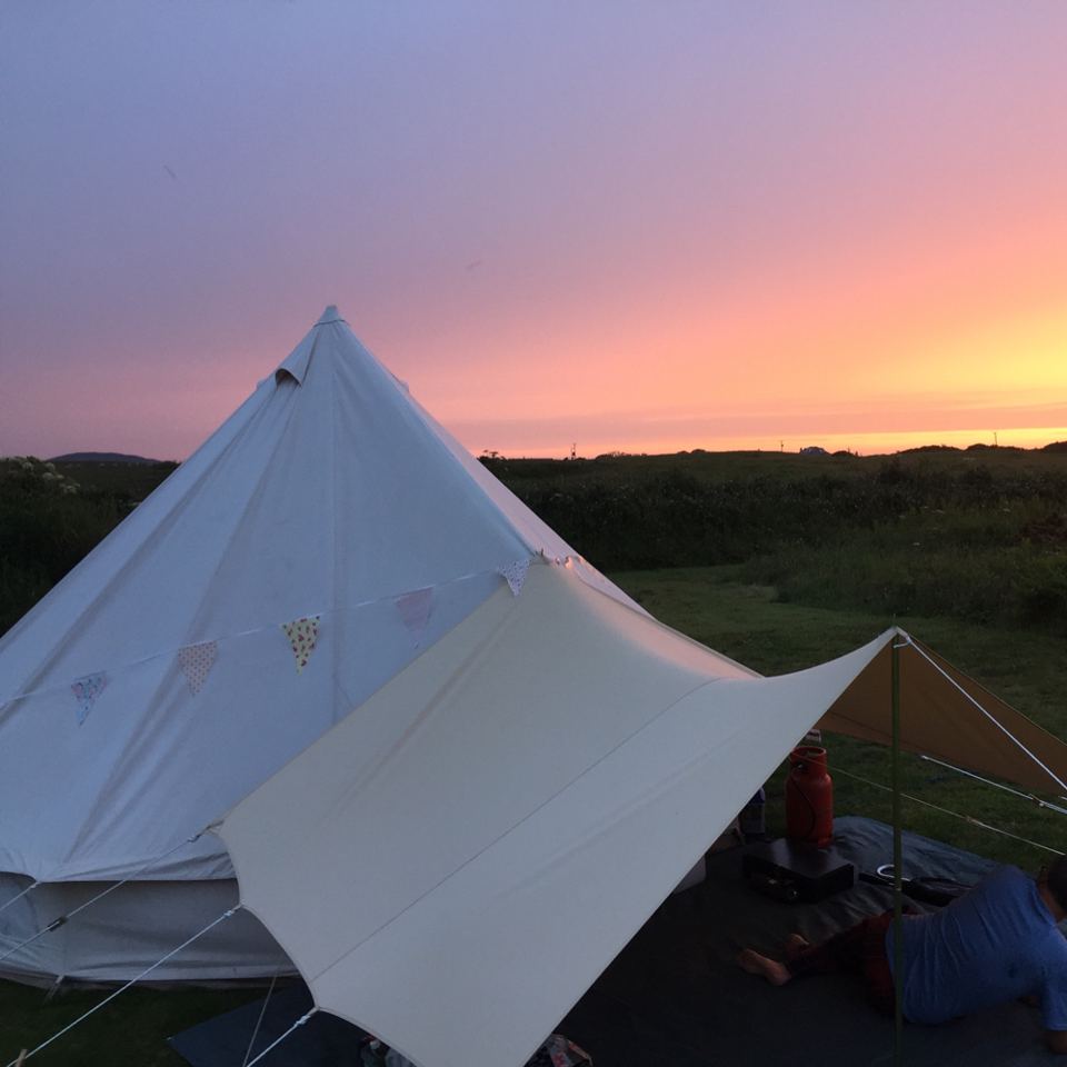 Bell tent with awning at sunset