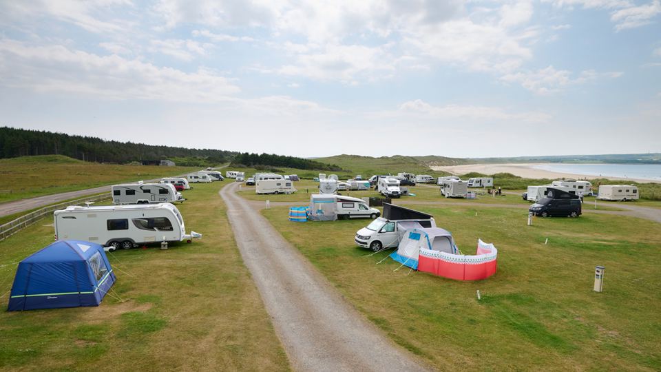 Tents and vans on the grass