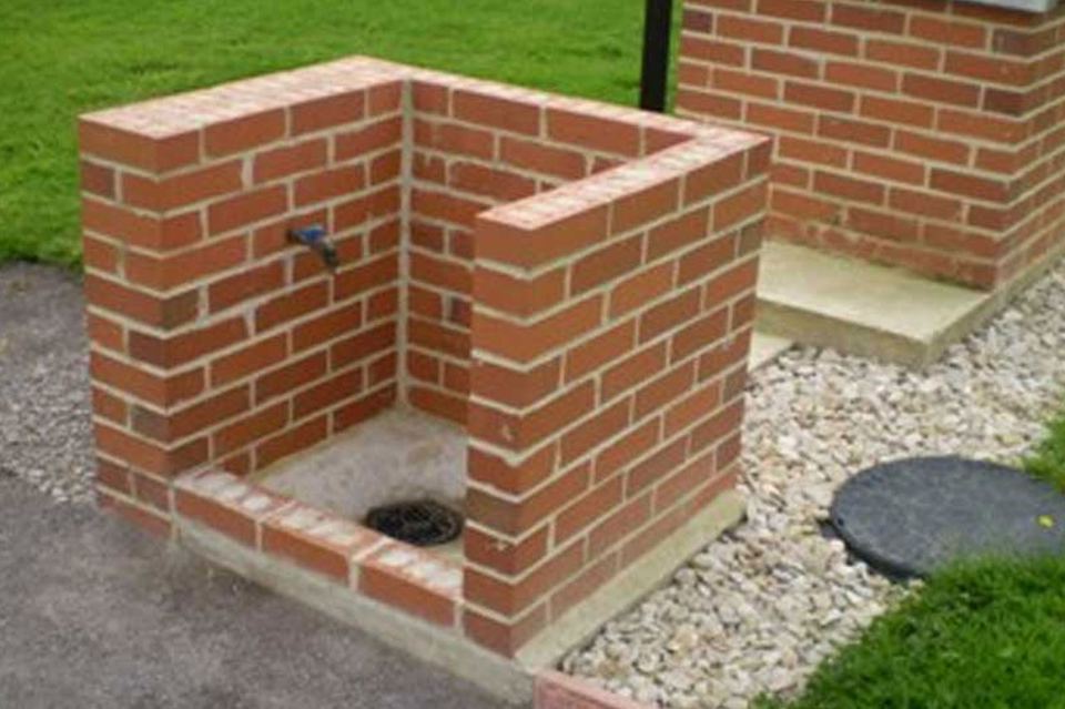 Brick barbecue on the gravel