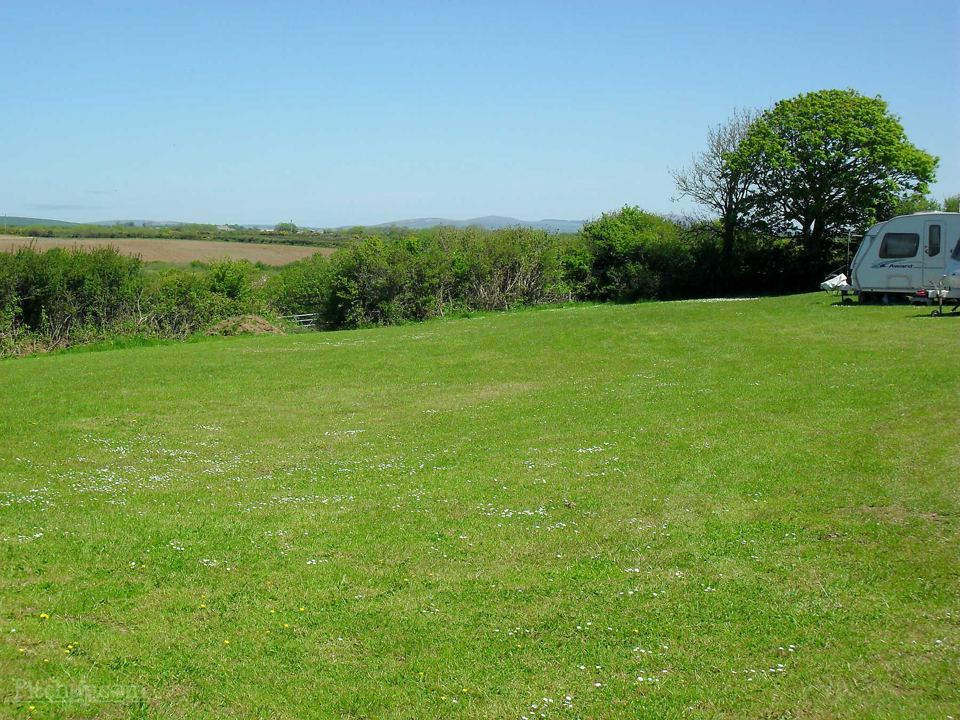 Grass field with a caravan