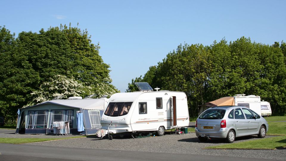 Caravan with awning on gravel
