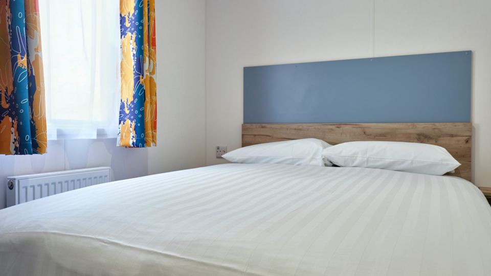 Double bedroom with blue headboard