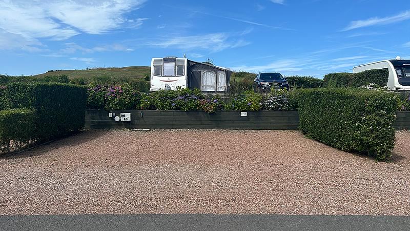 Gravel pitch with caravan