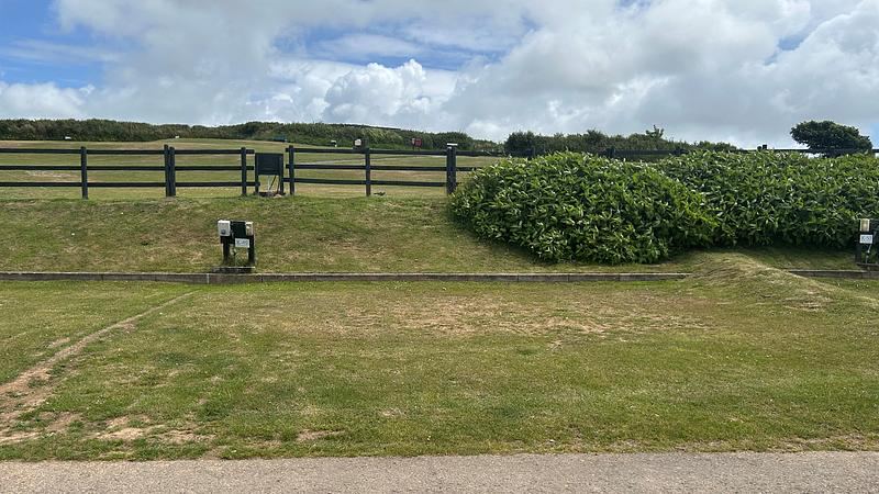 Grass pitch with hook-up post