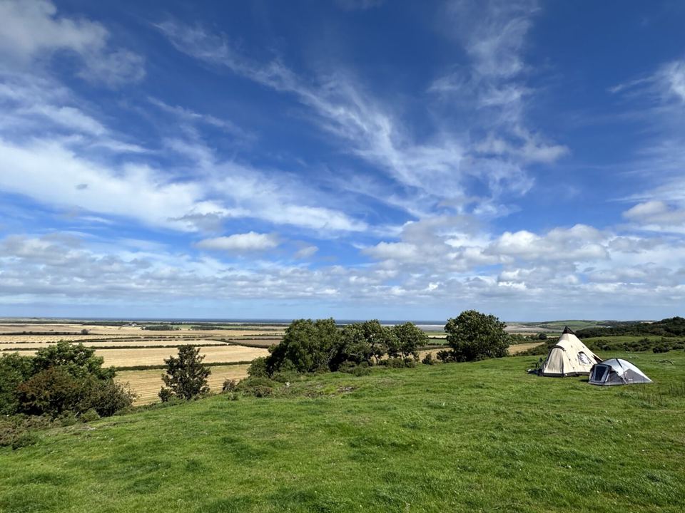 Tents on the grassy crag
