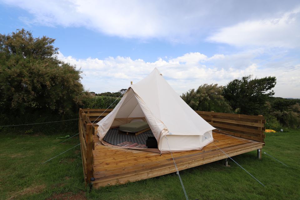 Bell tent beside the decking