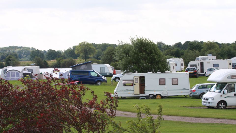 Tourers with countryside behind
