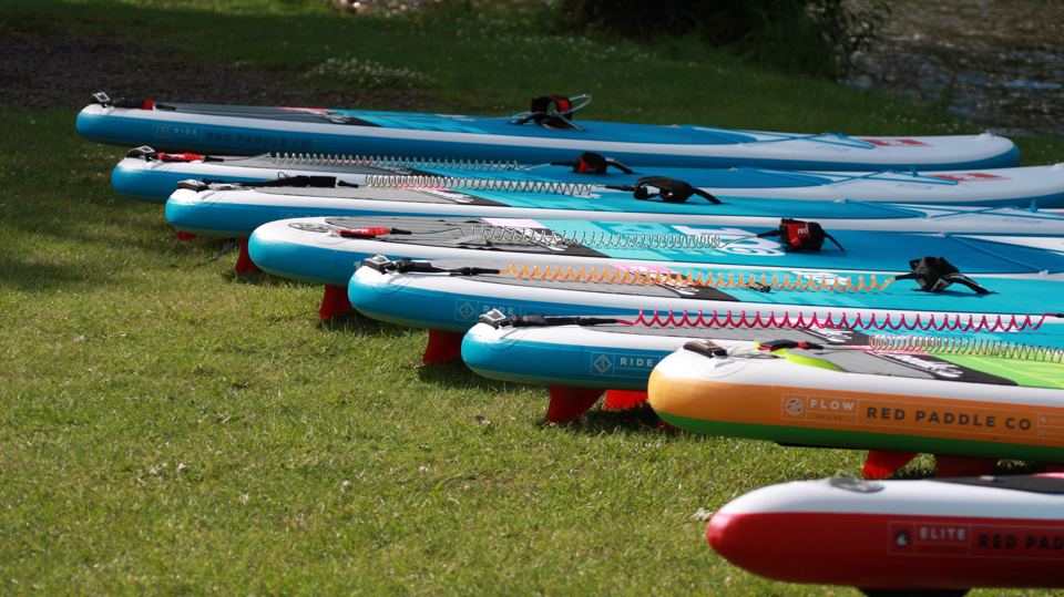 Paddle boards on the bank