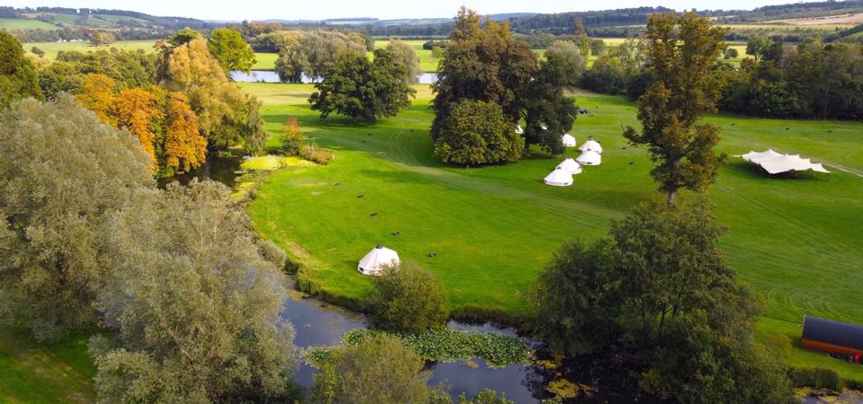 Bell tents on the Thames bank