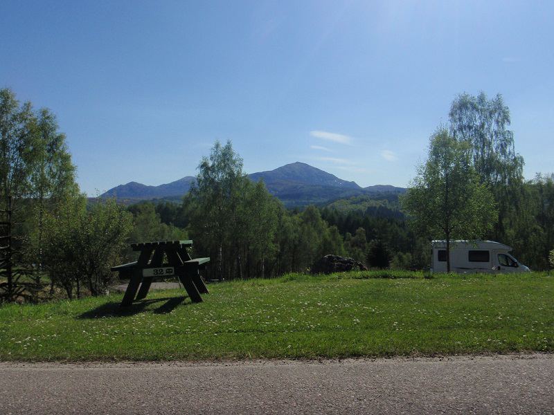 Motorhome pitch with hills beyond