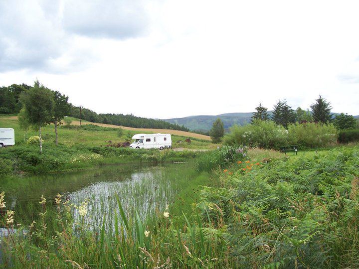 Pond with a motorhome beyond
