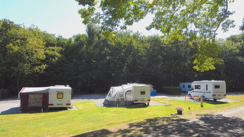 Caravans with awnings on grass