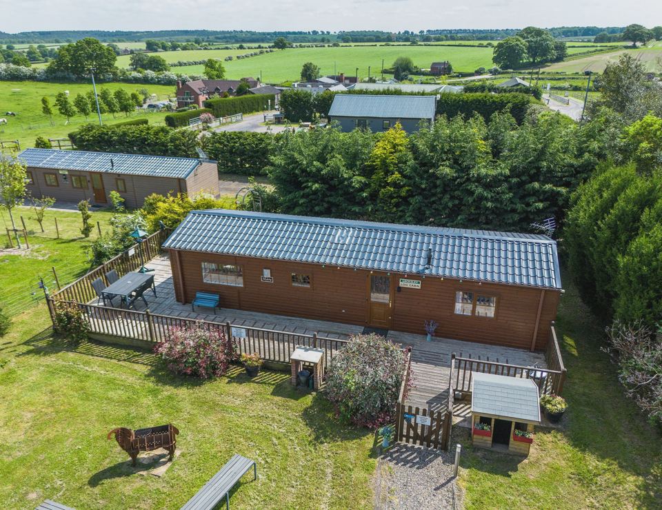 Log cabin and garden from above