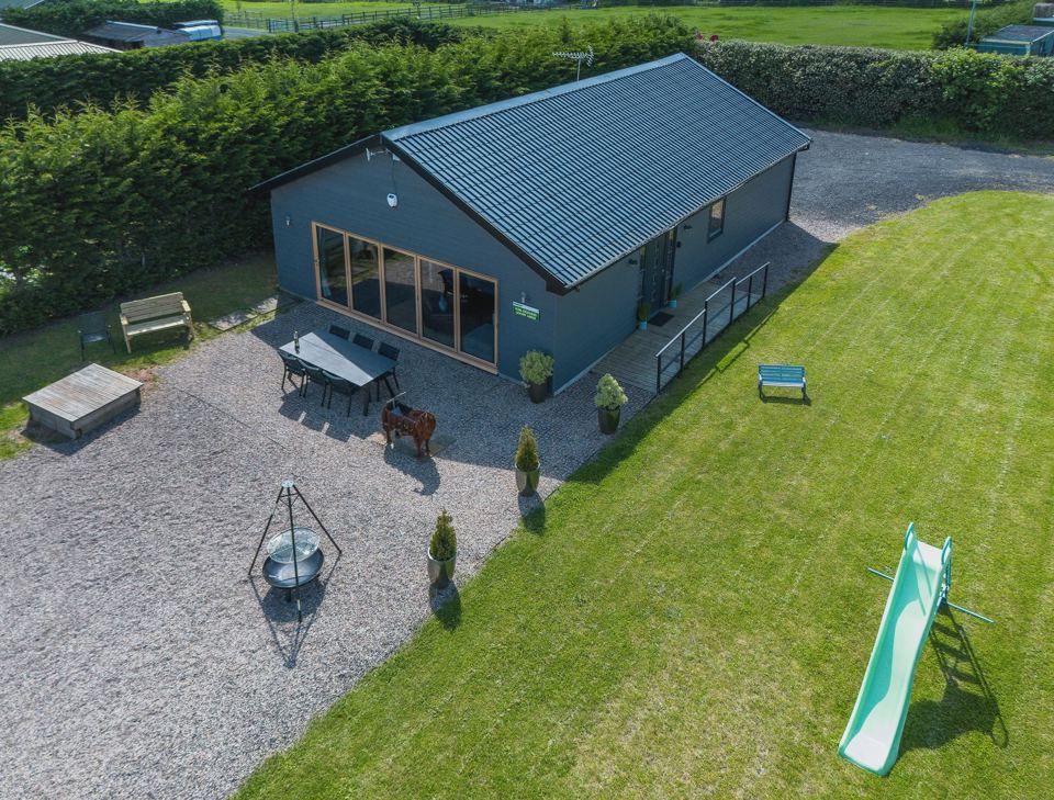 Lodge with fire pit and lawn