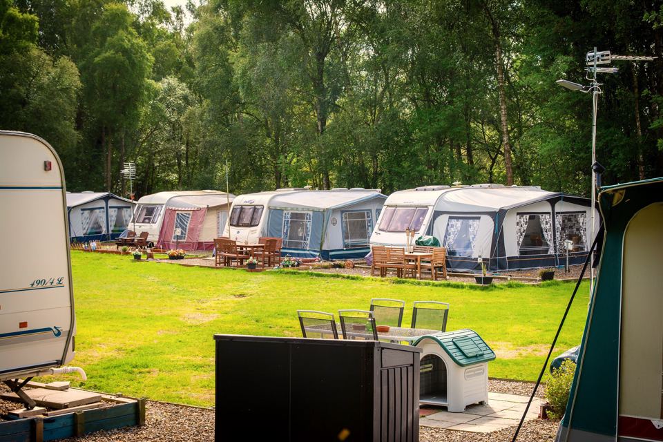 Caravans with awnings on grass
