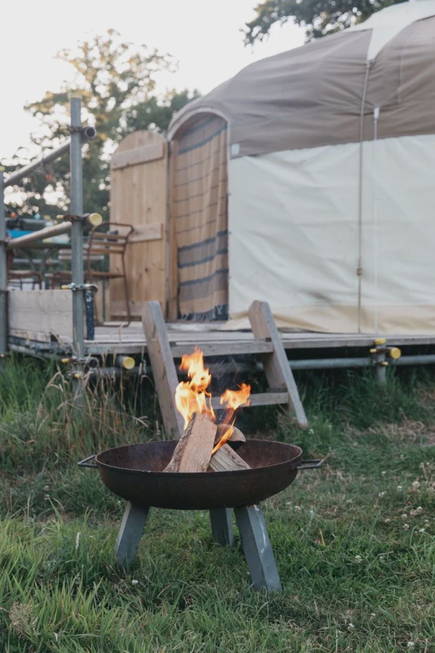 Yurt with a lit fire pit