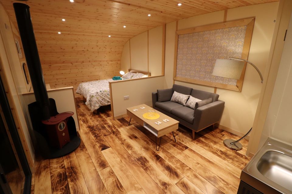 Inside a pod, bed and stove