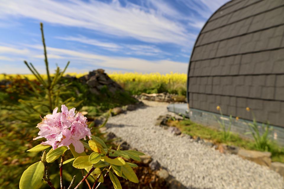 Side of the pod and gravel path