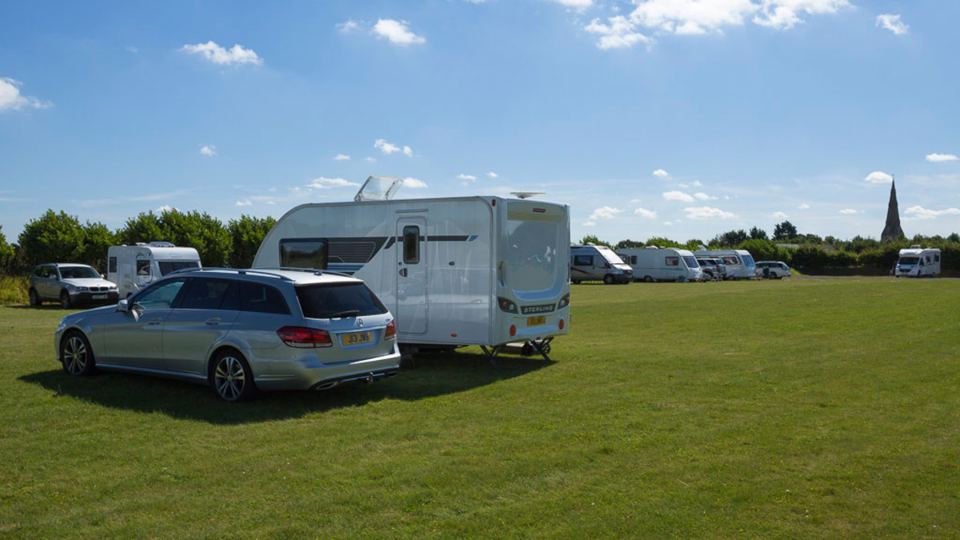 Caravan on open grass