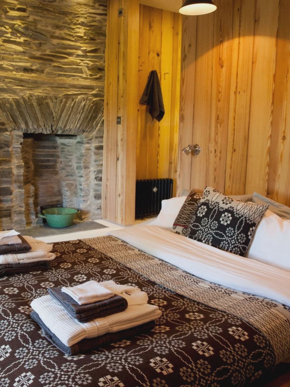 Bedroom with stone fireplace